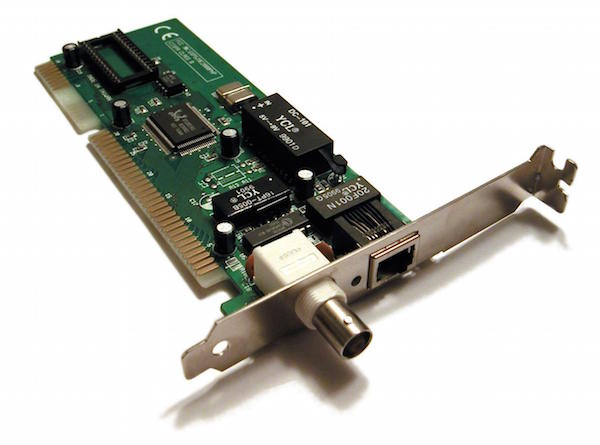 Photograph of an NIC. The card is a rectangular board. It has gold pins on the left and it has a metal end. There are two ports protruding from the metal end: a coaxial port and an Ethernet port.
